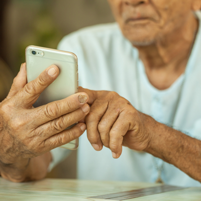 elderly man on a smart phone